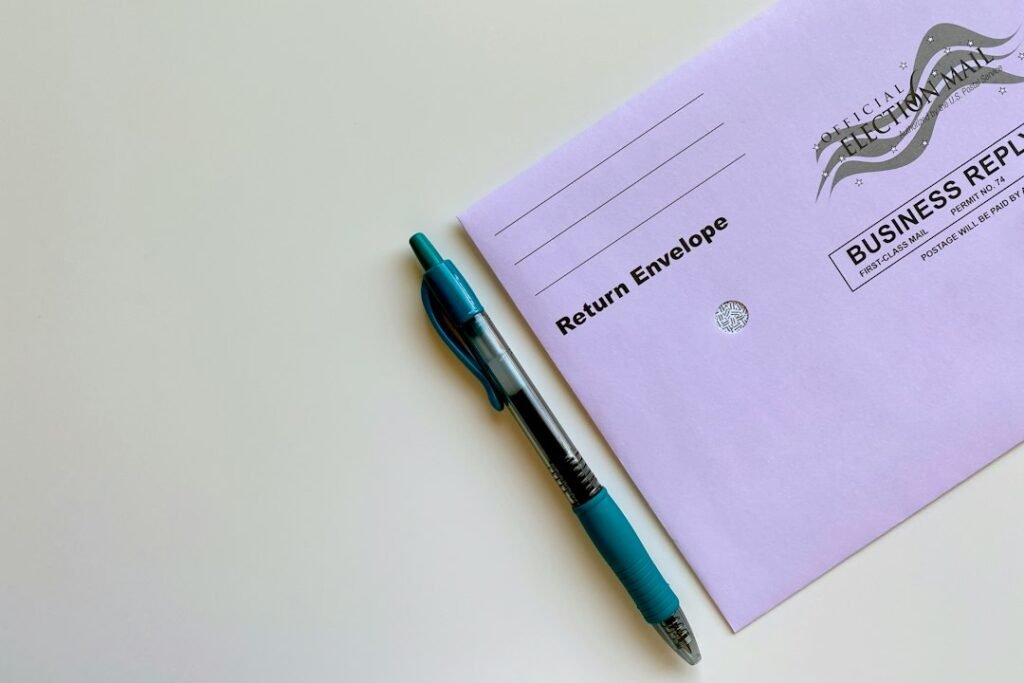 American election ballot envelope with pen illustrating campaign finance reporting