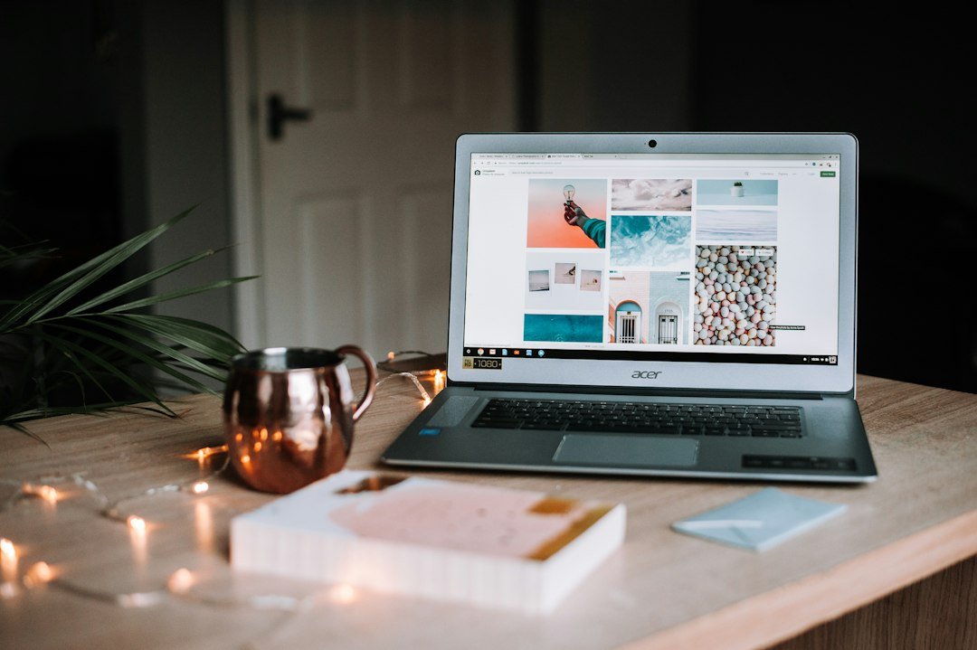 Laptop and notebook on a desk for planning a blog content strategy